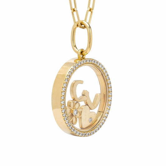 Side view of glass locket with floating charms