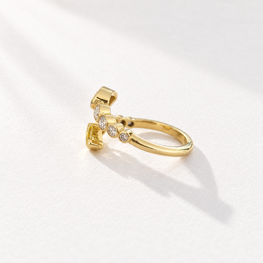 Afterglow 18K gold open bypass ring with bezel-set yellow and white diamonds, side view