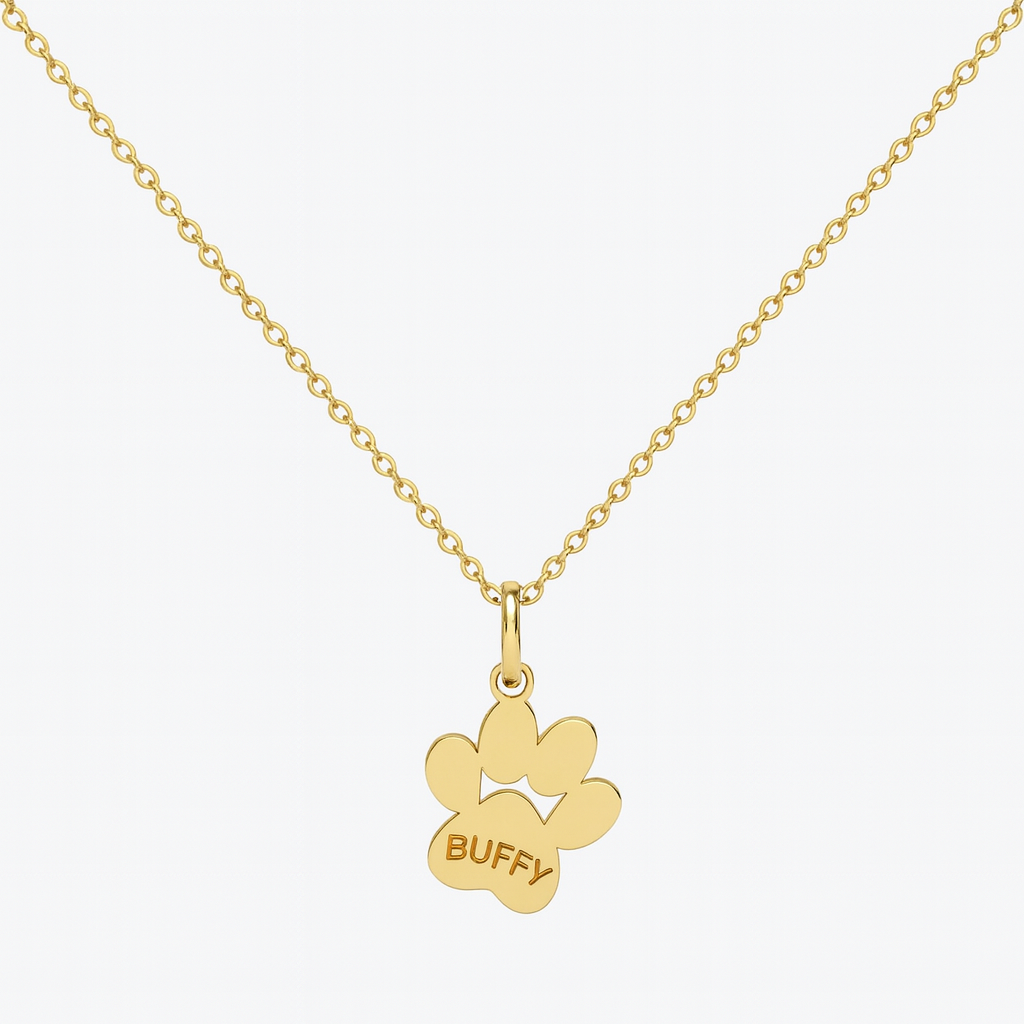 Image of an 18k gold paw print pendant on a chain personalised with a pet’s name 