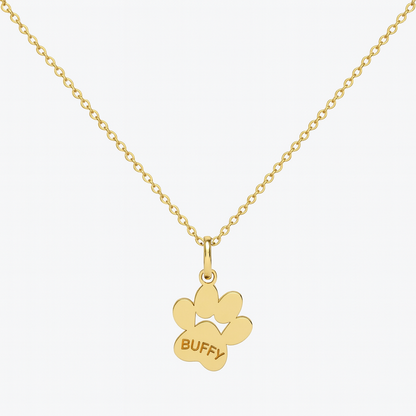 Image of an 18k gold paw print pendant on a chain personalised with a pet’s name 