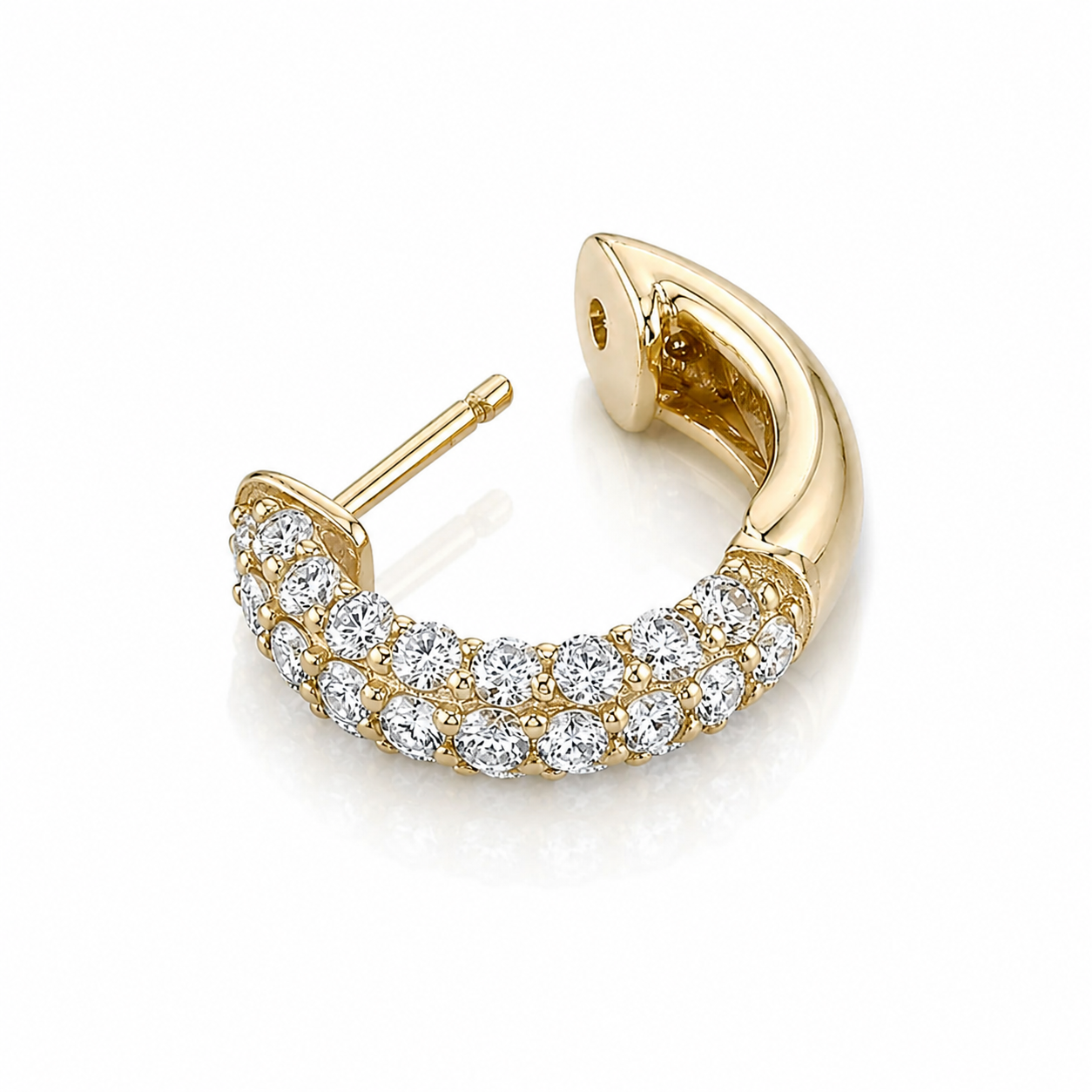 Gold earring with diamonds on a white background