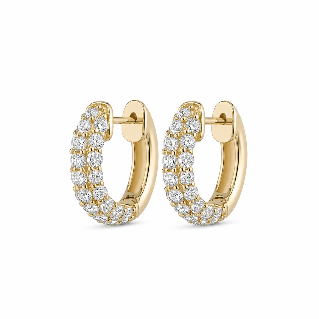 Gold hoop earrings with diamond accents on a white background