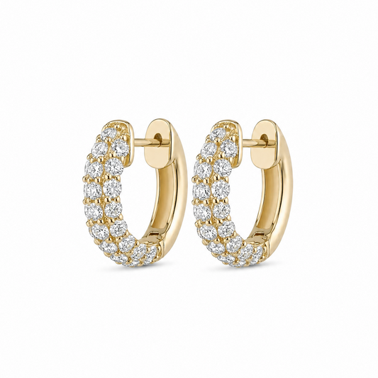 Gold hoop earrings with diamond accents on a white background