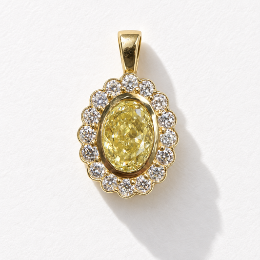Marigold 1 carat oval yellow diamond halo charm in 18K gold, front view