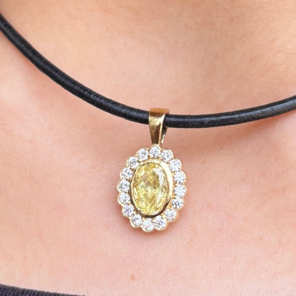 Marigold yellow diamond halo charm worn on a black cord