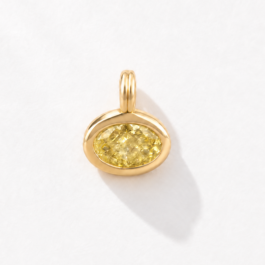 Solstice 2 carat IGI-certified yellow oval diamond charm in 18K gold, front view