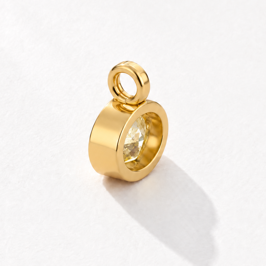 Solstice 2 carat IGI-certified yellow oval diamond charm in 18K gold, rear three-quarter view