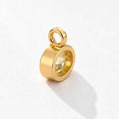 Solstice 2 carat IGI-certified yellow oval diamond charm in 18K gold, rear three-quarter view
