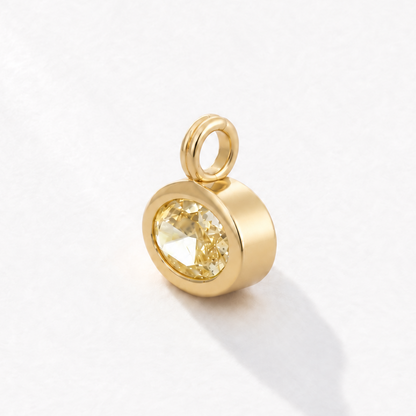 Solstice 2 carat IGI-certified yellow oval diamond charm in 18K gold, three-quarter view