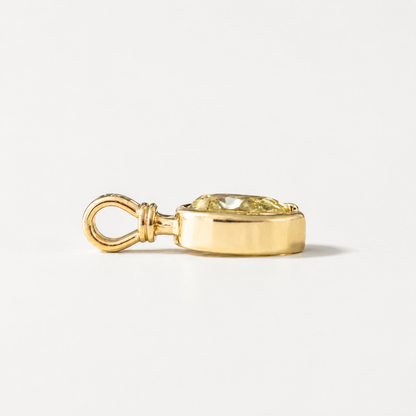 Side profile of Sundrop charm showing the yellow gold setting and bail.
