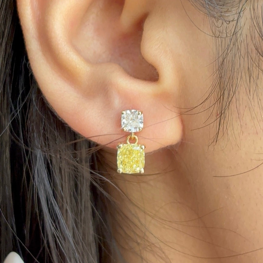 Sunlit yellow and white diamond drop earring worn on the ear