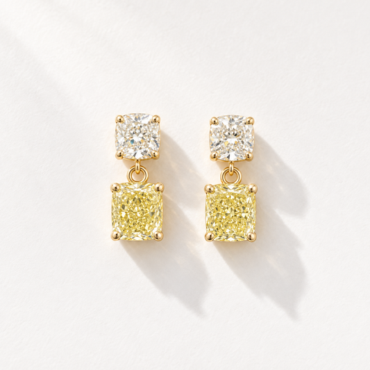Sunlit 18K gold drop earrings with white cushion diamonds and yellow cushion diamonds, front view