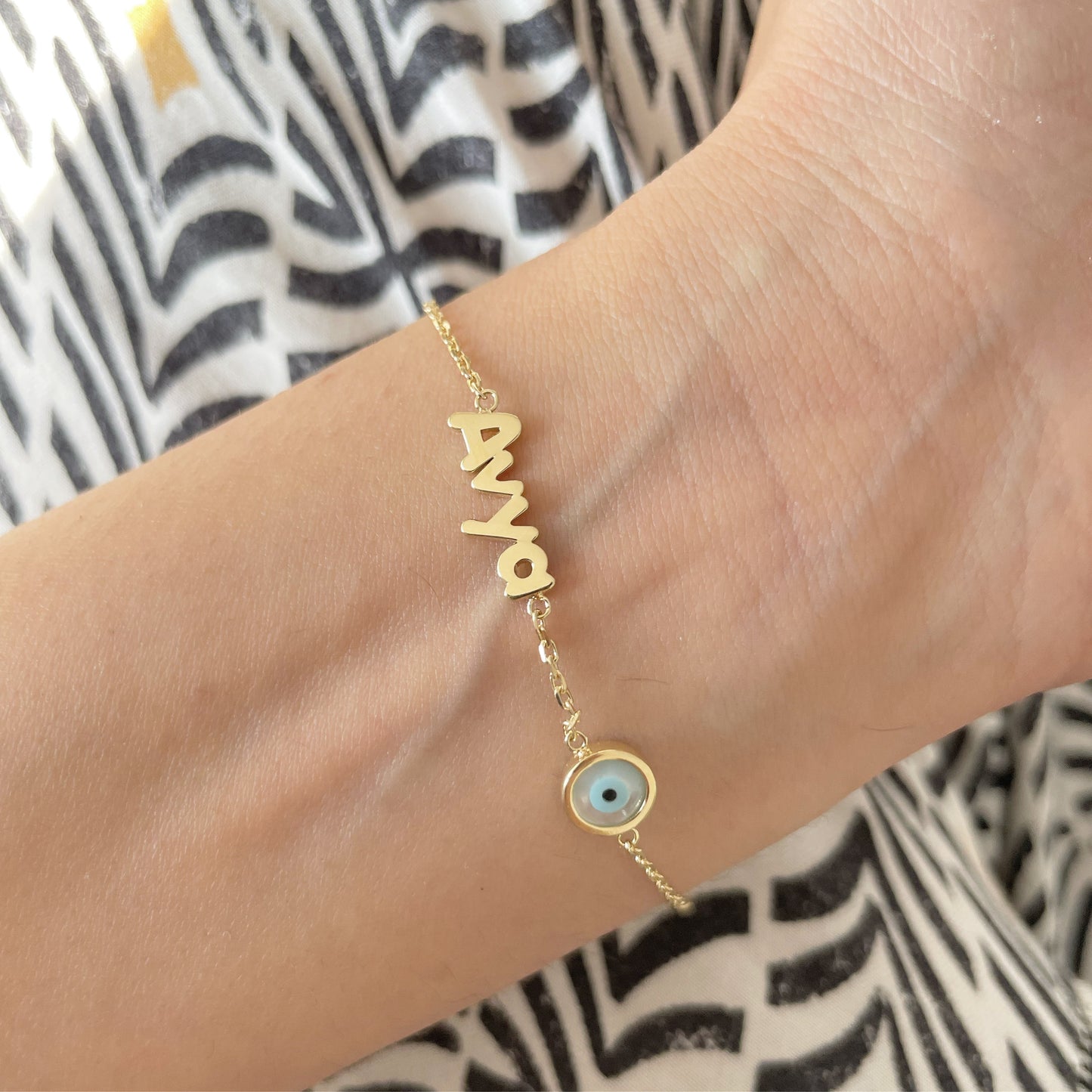 Name Bracelet With an Evil Eye